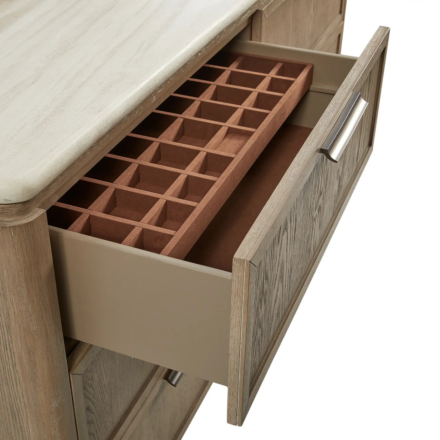 Wood kitchen drawer with built-in storage organizer and metal handle, beneath stone countertop