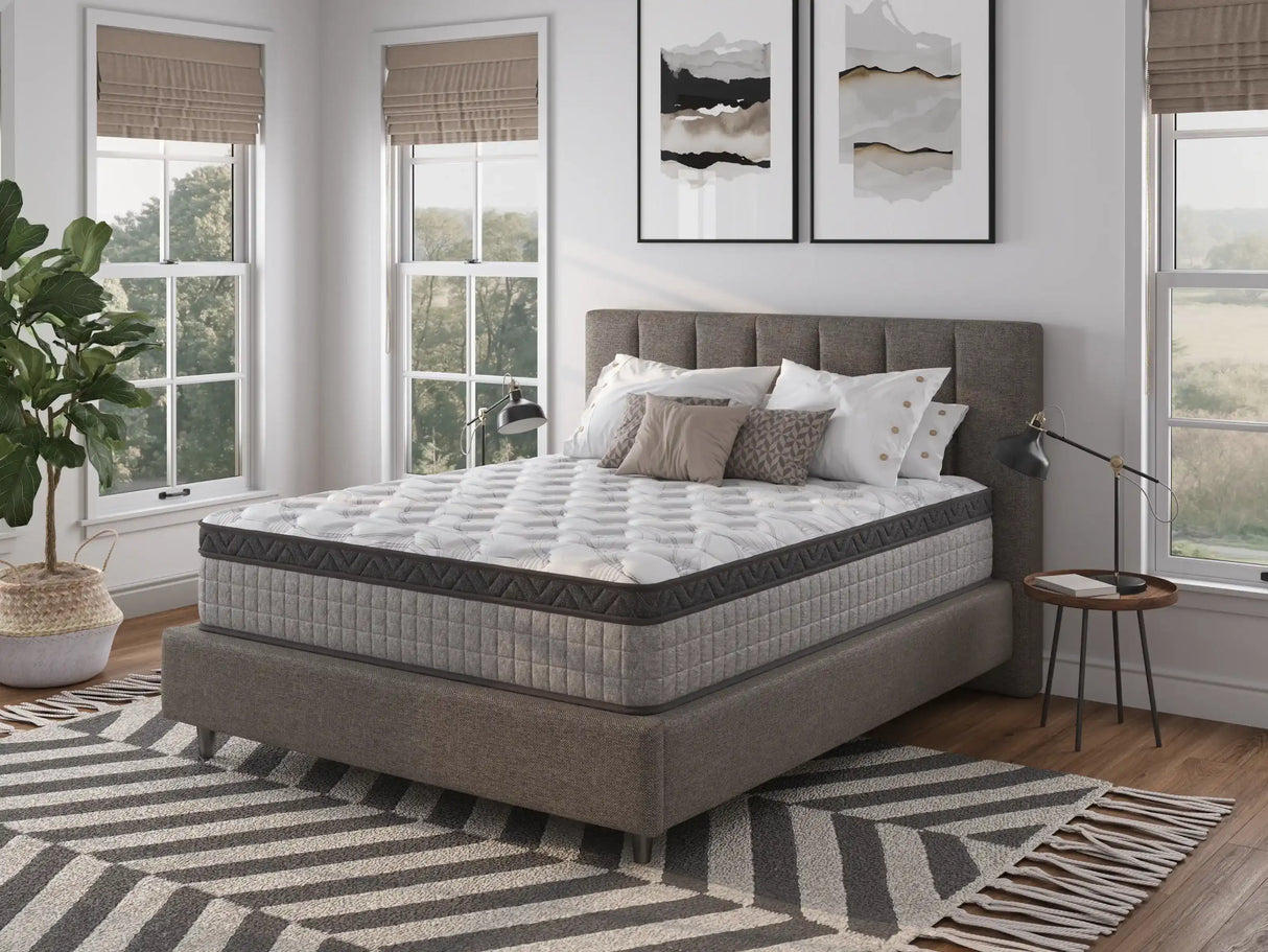 Modern bedroom with gray upholstered bed, mattress, throw pillows, and large windows