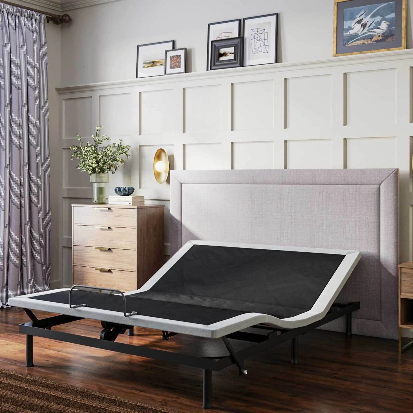 Adjustable bed frame in modern bedroom with wood furniture and panel wall decor