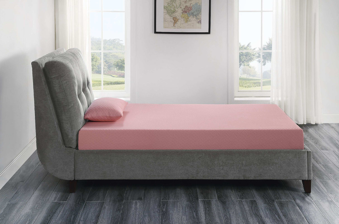 Modern bedroom with a pink mattress and pillow on a gray upholstered bed frame, large windows