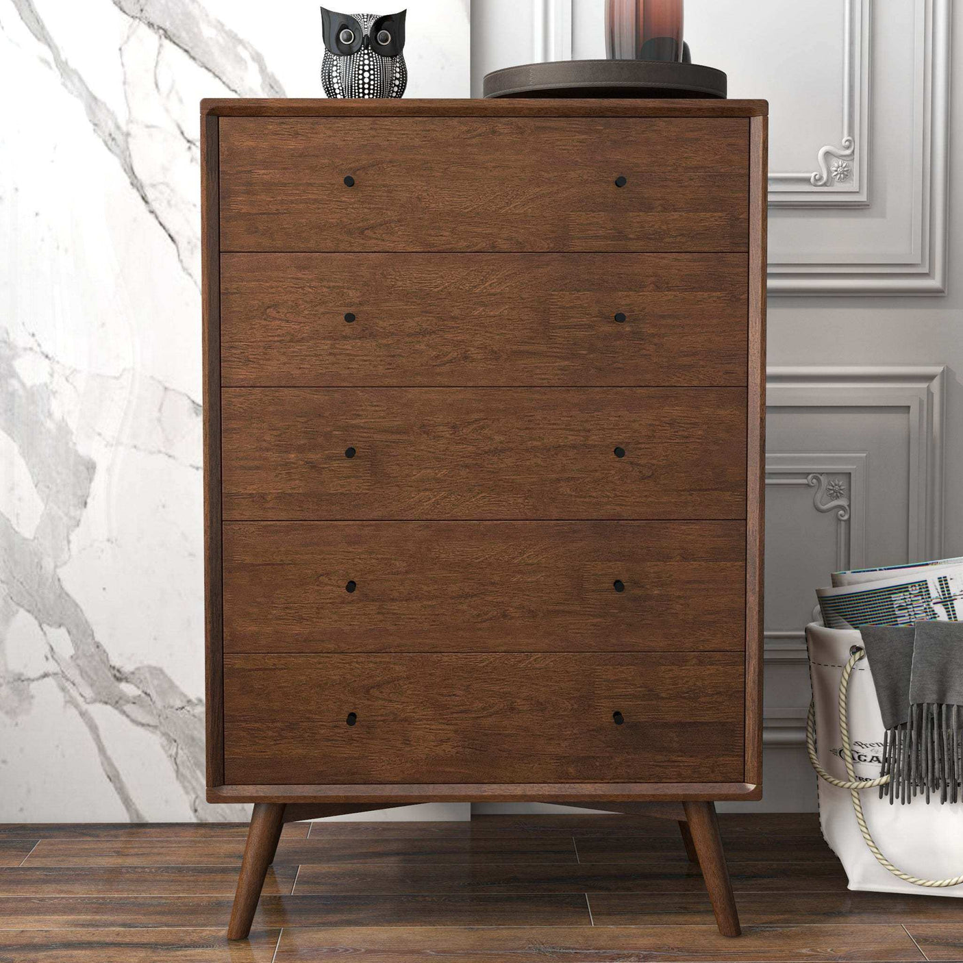 Mid-century modern brown wooden dresser with four drawers, in a stylish interior setting