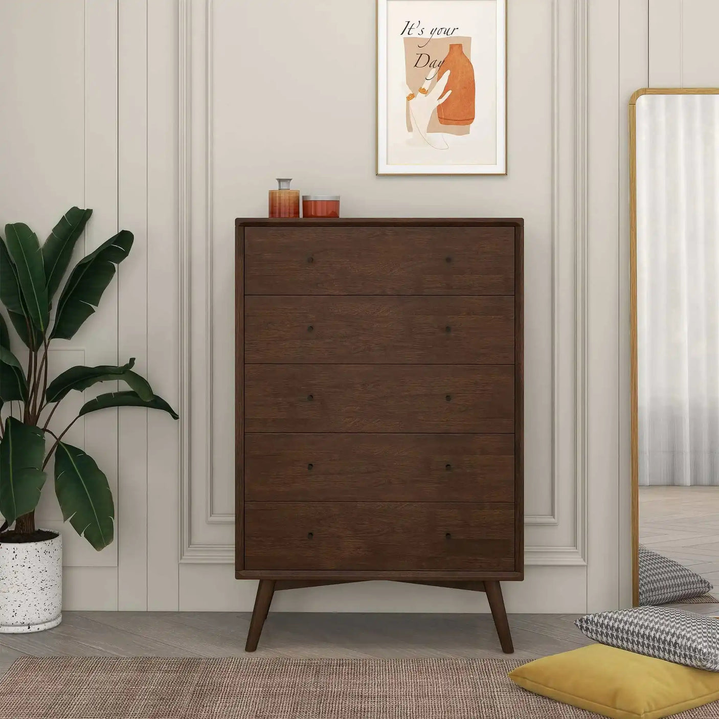 Mid-century modern dark wood dresser in bedroom with potted plant and decorative wall art