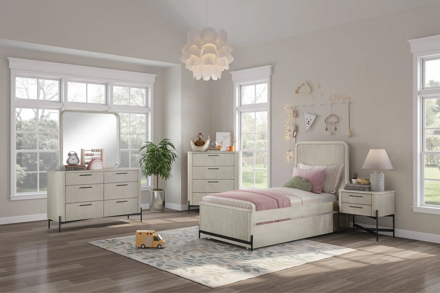 Modern kids bedroom with light wood bed, dresser, nightstand, floral rug and playful decor