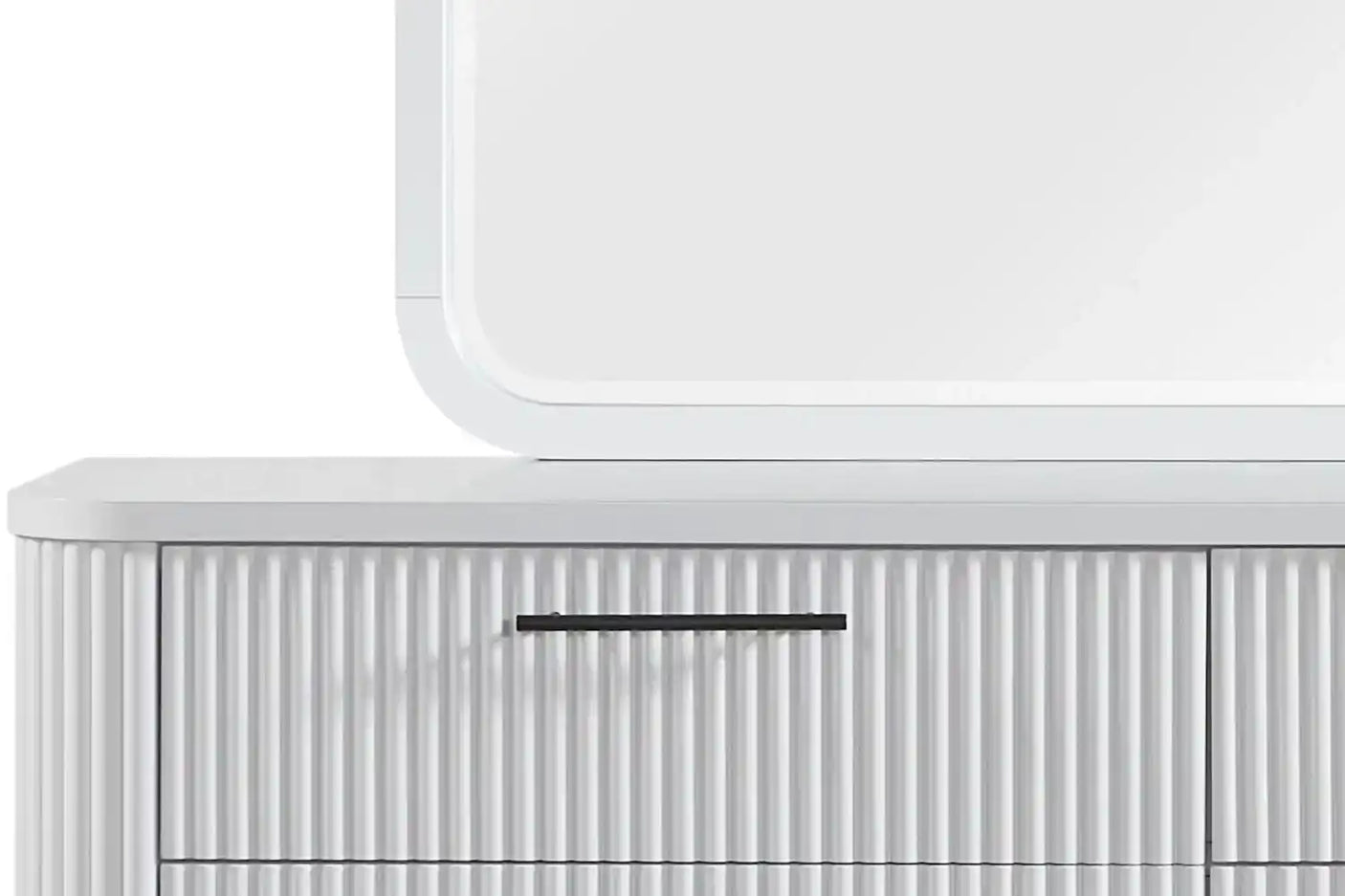 Modern white ribbed dresser with black handle and rounded mirror