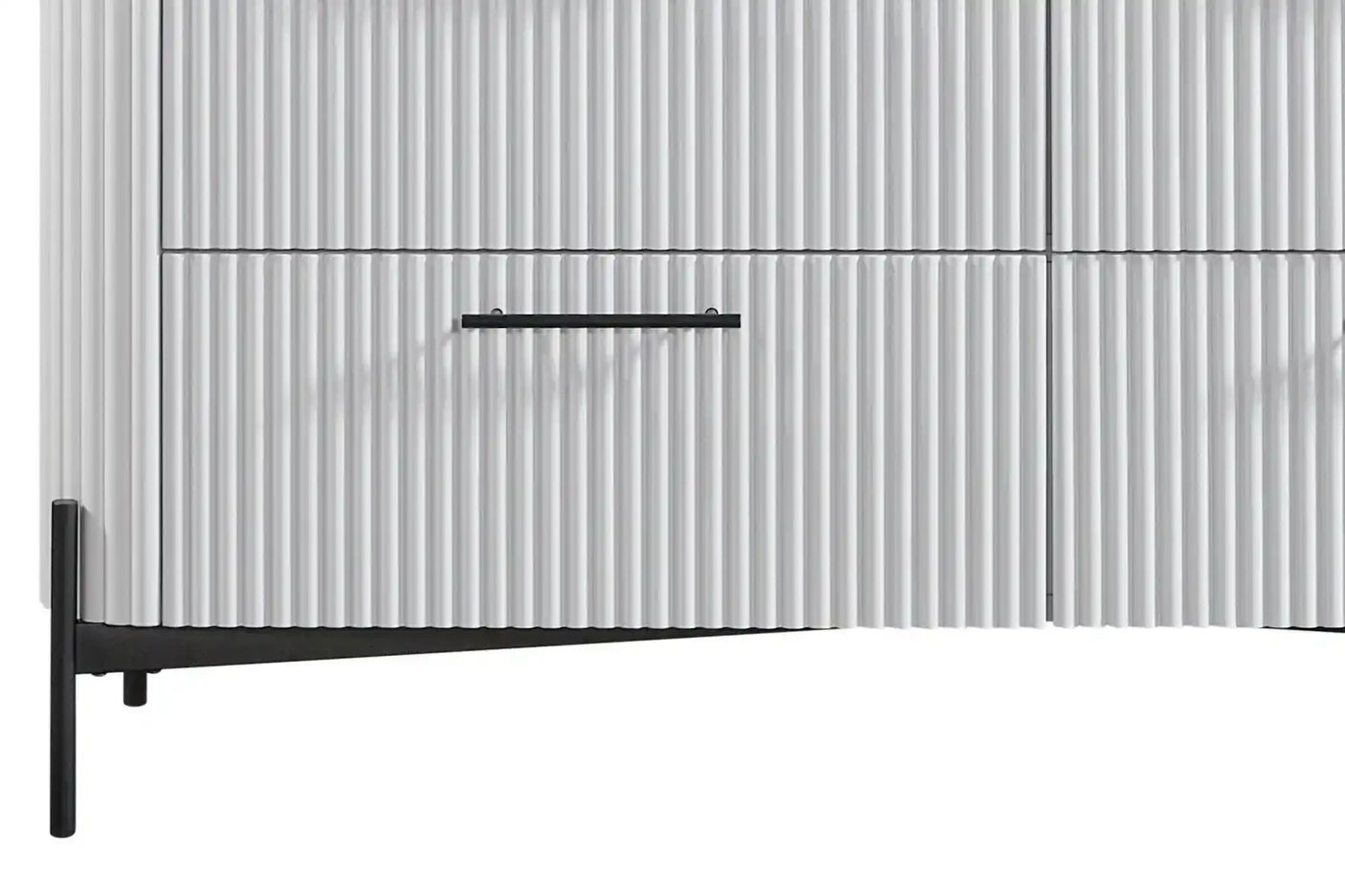 Modern white fluted cabinet with black metal legs and handle