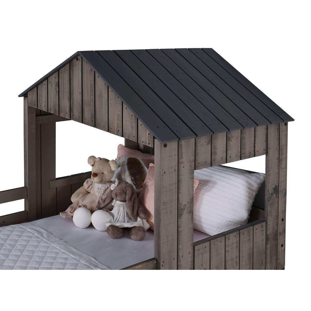 Rustic gray twin over full loft bed with house frame, stuffed animals, and pillows
