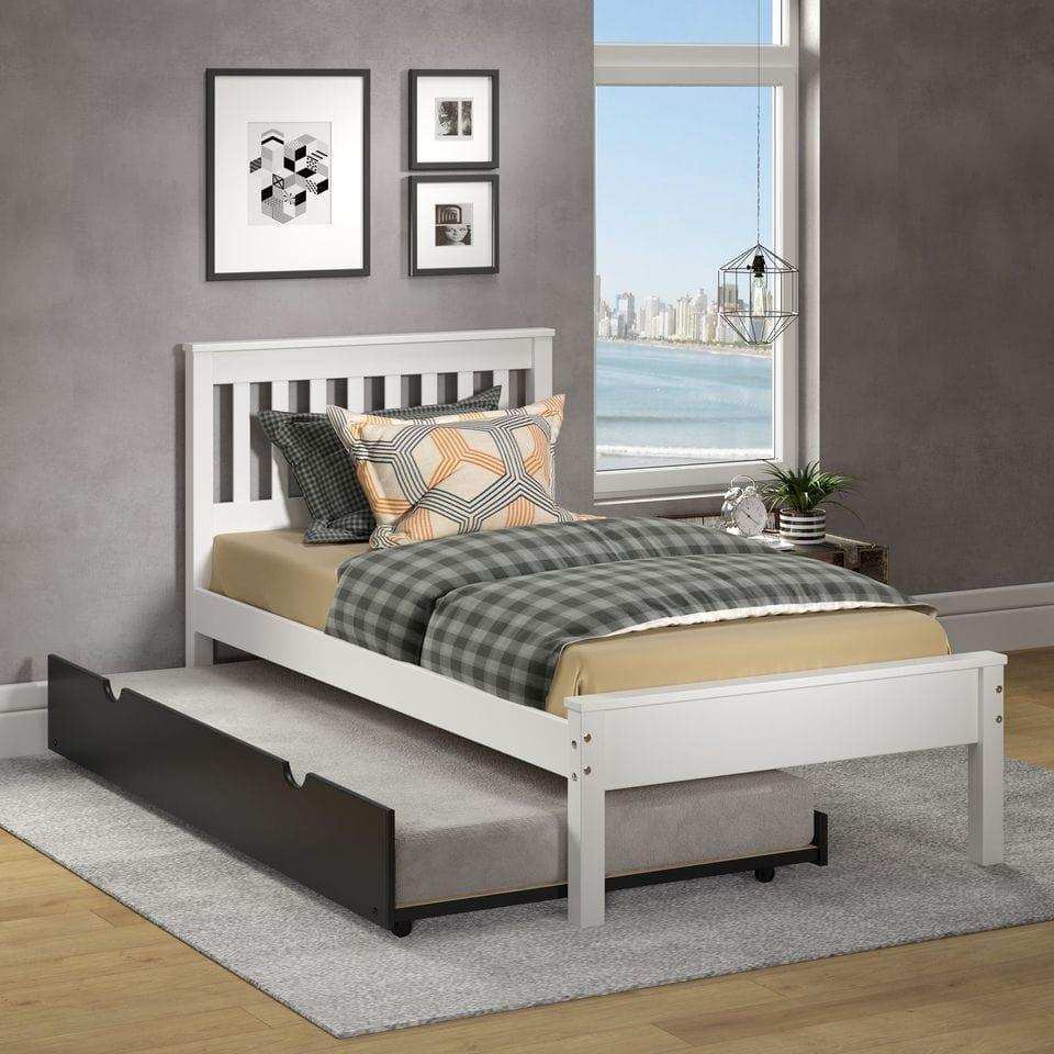 White twin bed with black trundle in modern bedroom, city view window, geometric wall art