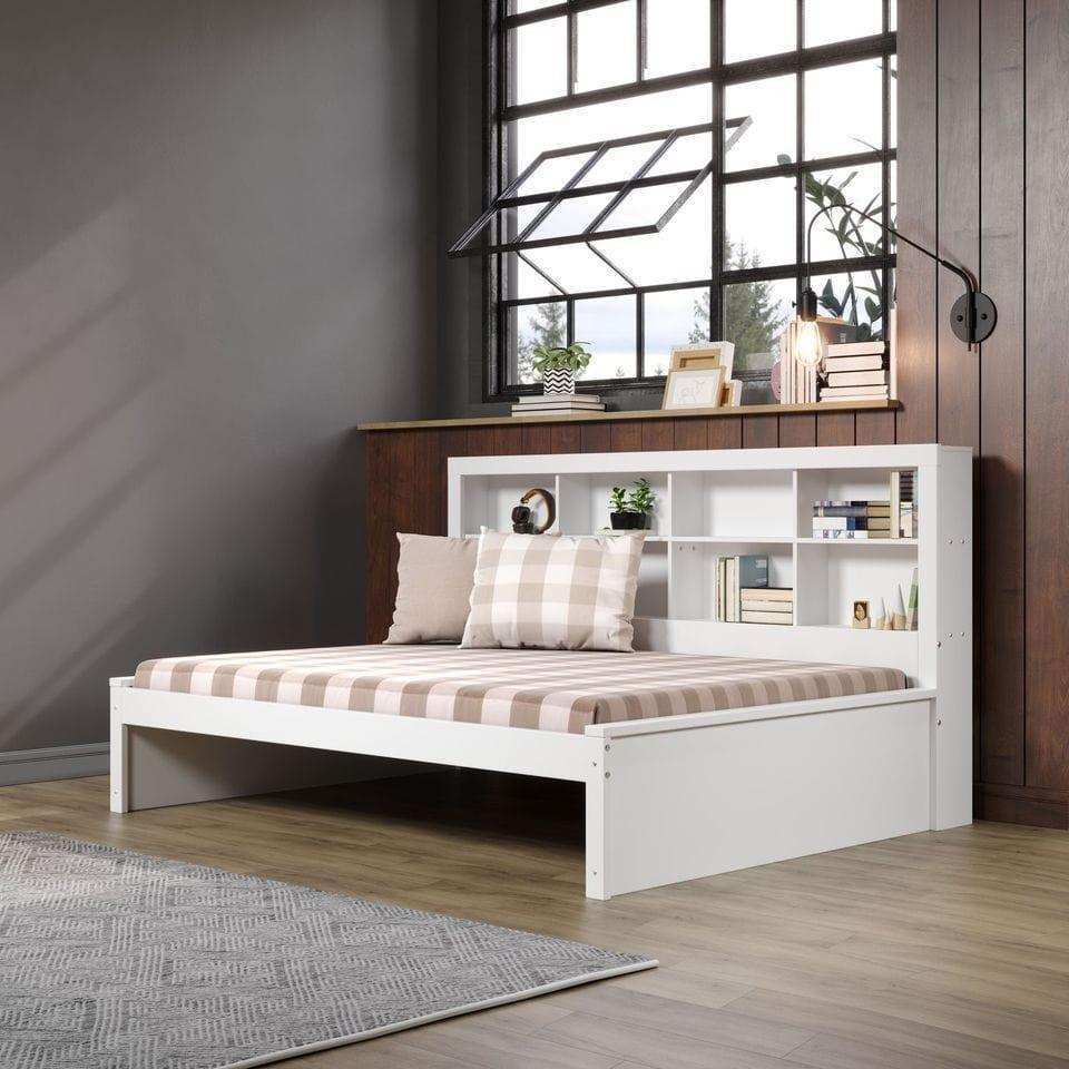 White full daybed with bookcase headboard in modern bedroom, plaid bedding, large window