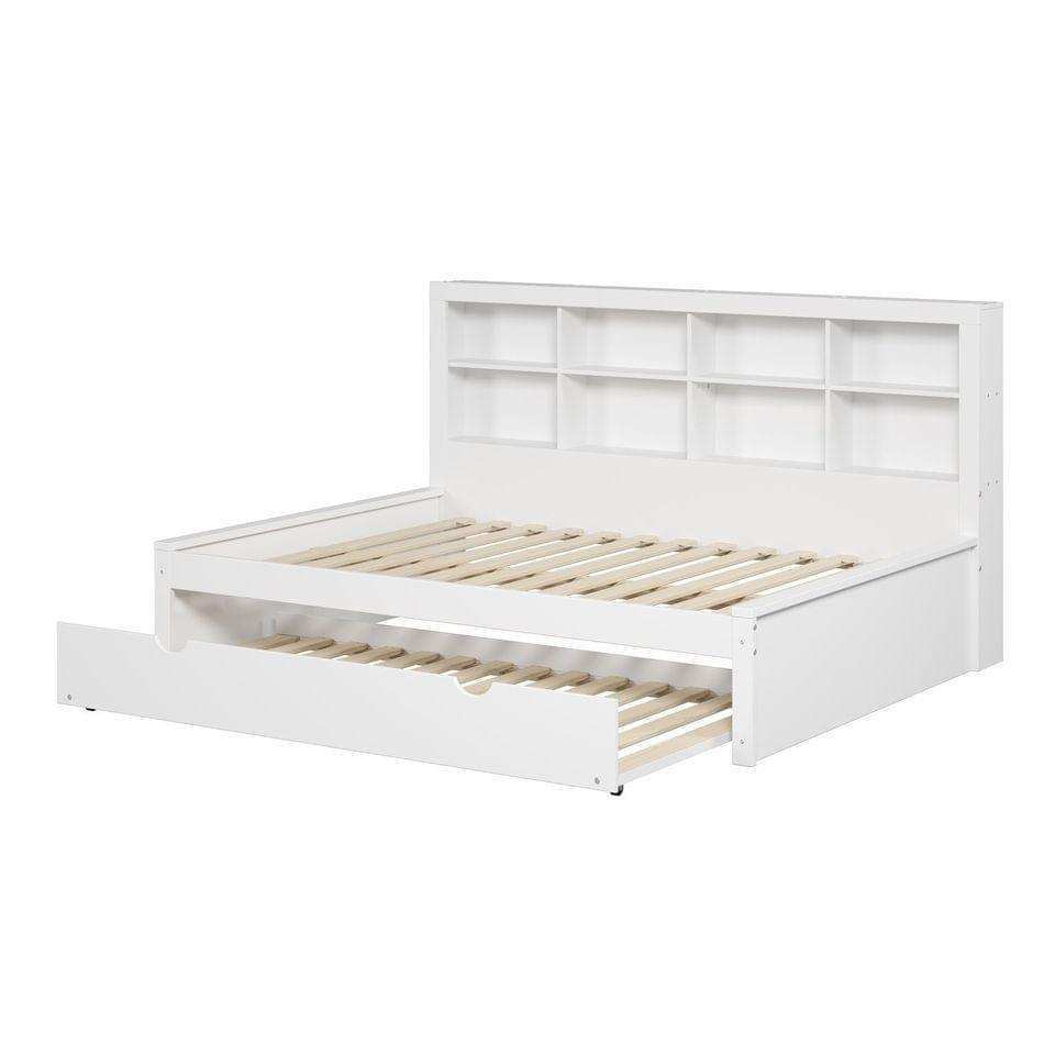 White wooden daybed with bookcase headboard and pull-out twin trundle bed