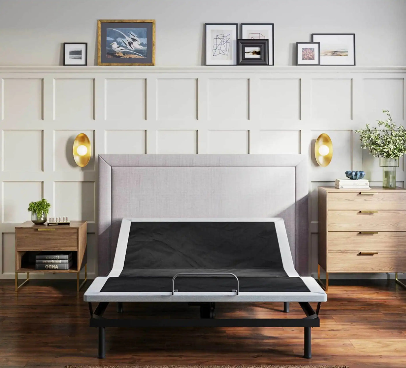 Modern bedroom with adjustable bed frame, minimalist decor, nightstands, and wall art