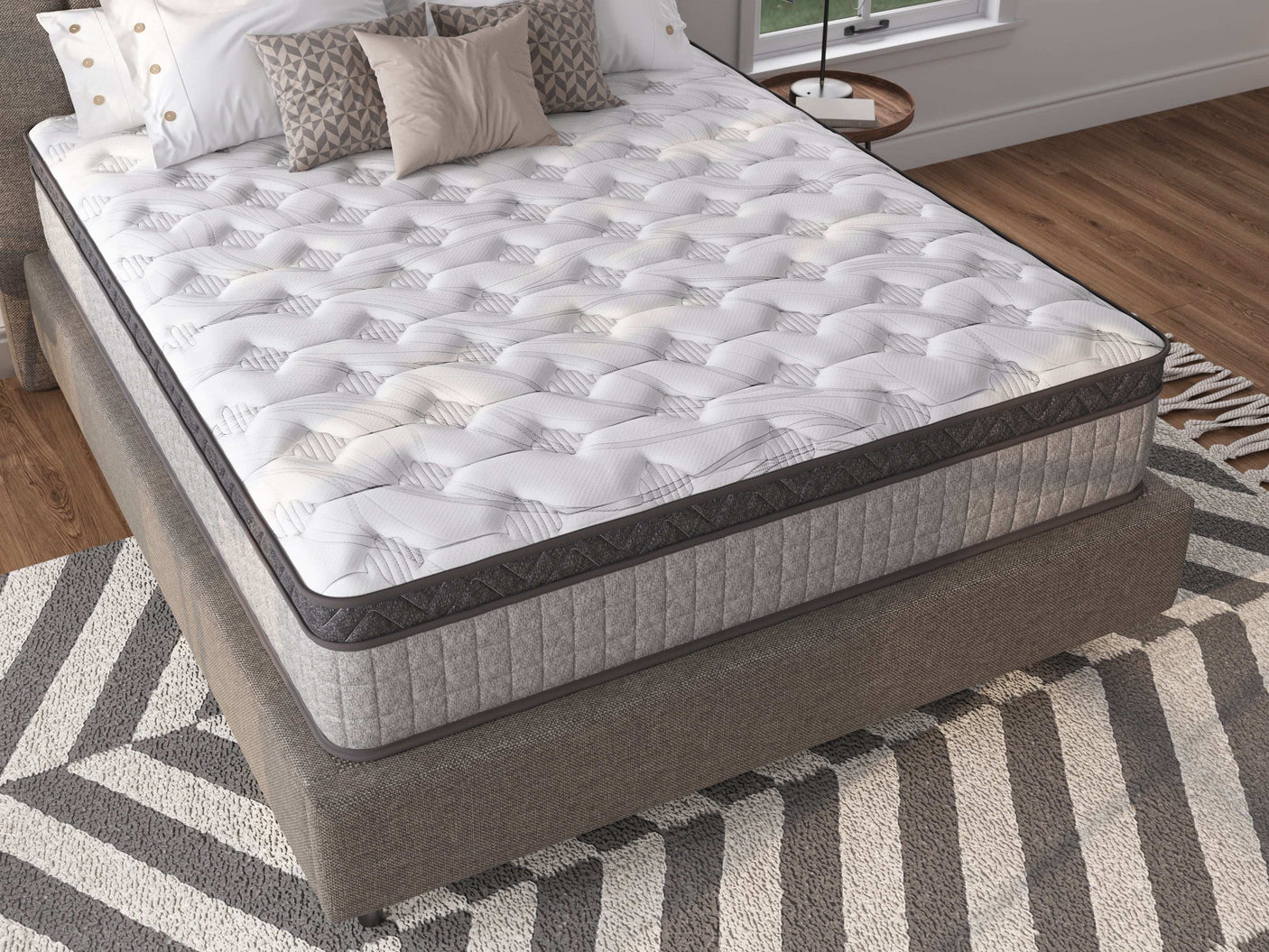 Modern mattress with pillows on top of mattress, grey and white mattress cover
