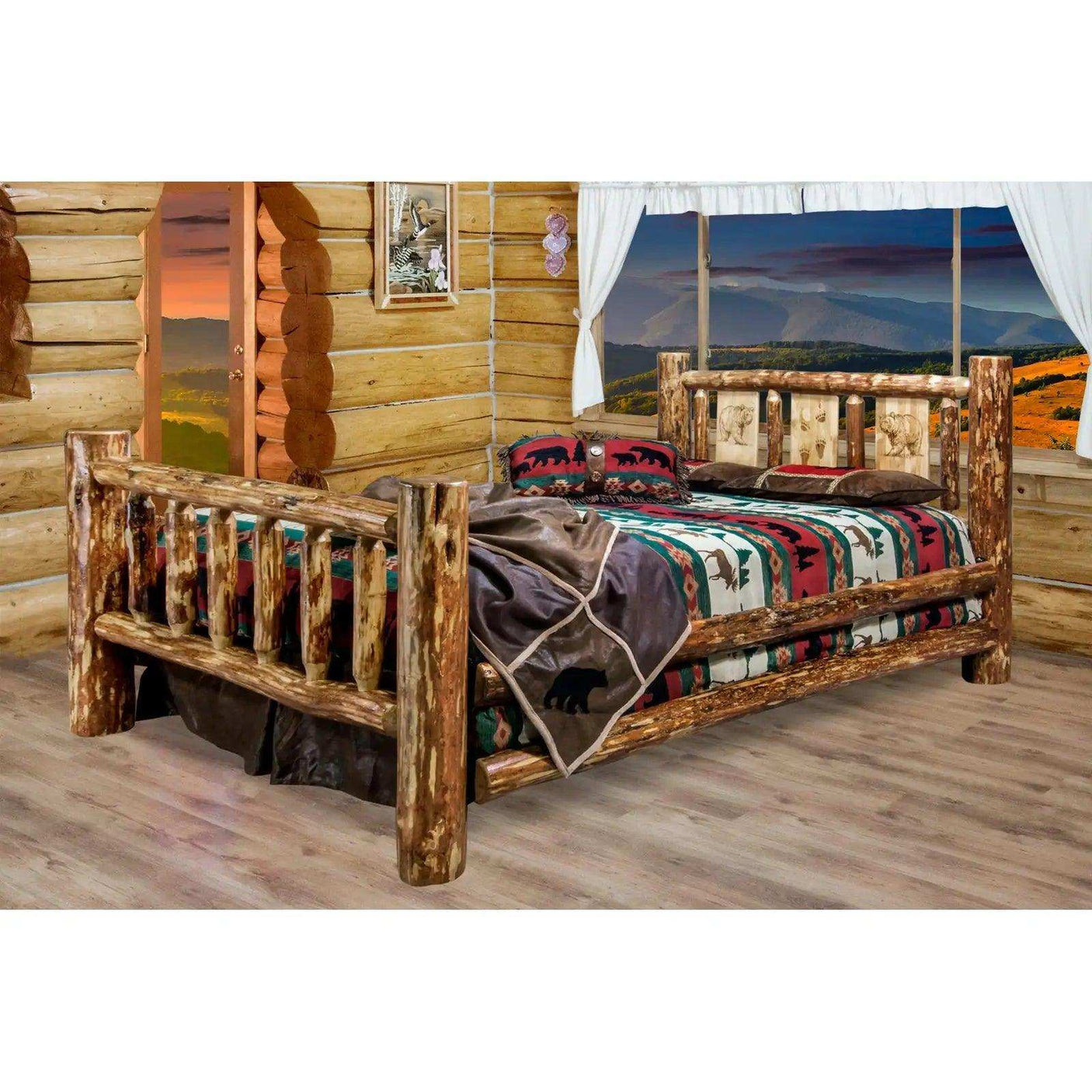 Rustic king log bed with laser engraved headboard in a log cabin bedroom, mountain view window