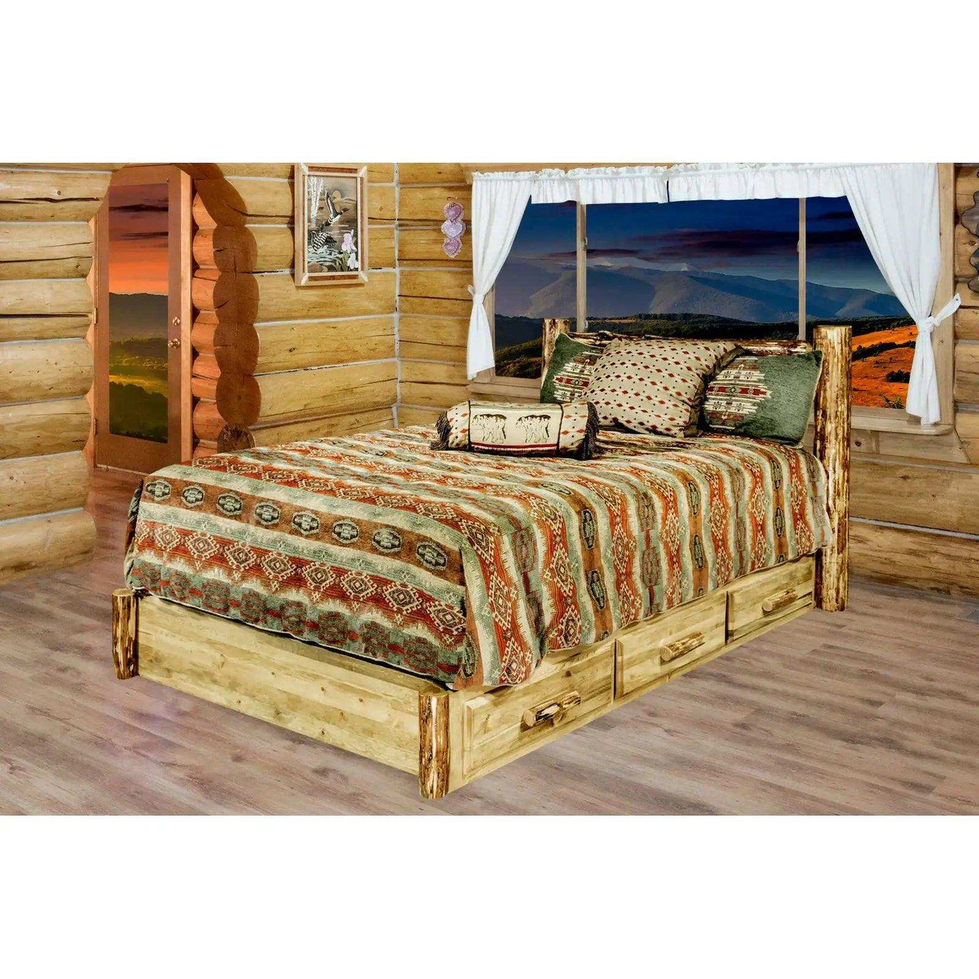 Rustic king platform bed with storage drawers in a log cabin bedroom, mountain view window