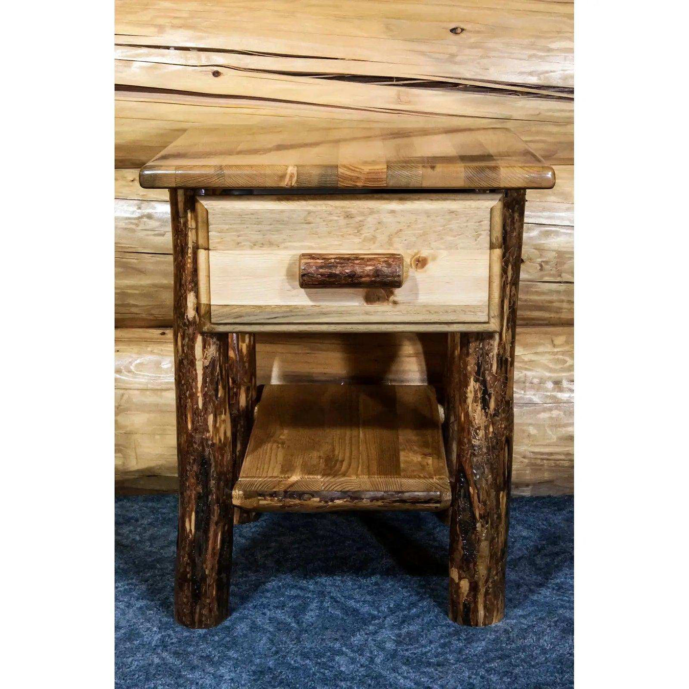 Rustic wooden nightstand with drawer and shelf, log legs, in a cabin bedroom setting