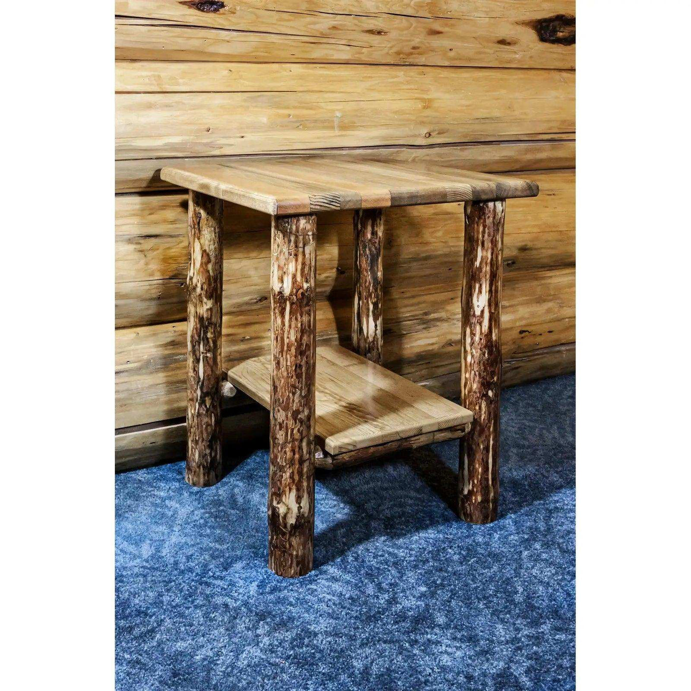 Rustic wood nightstand with shelf, log legs, in a cabin bedroom with blue carpet