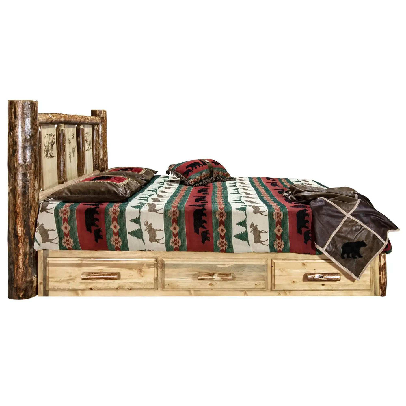 Rustic king platform bed with storage drawers and carved log headboard, cabin bedding