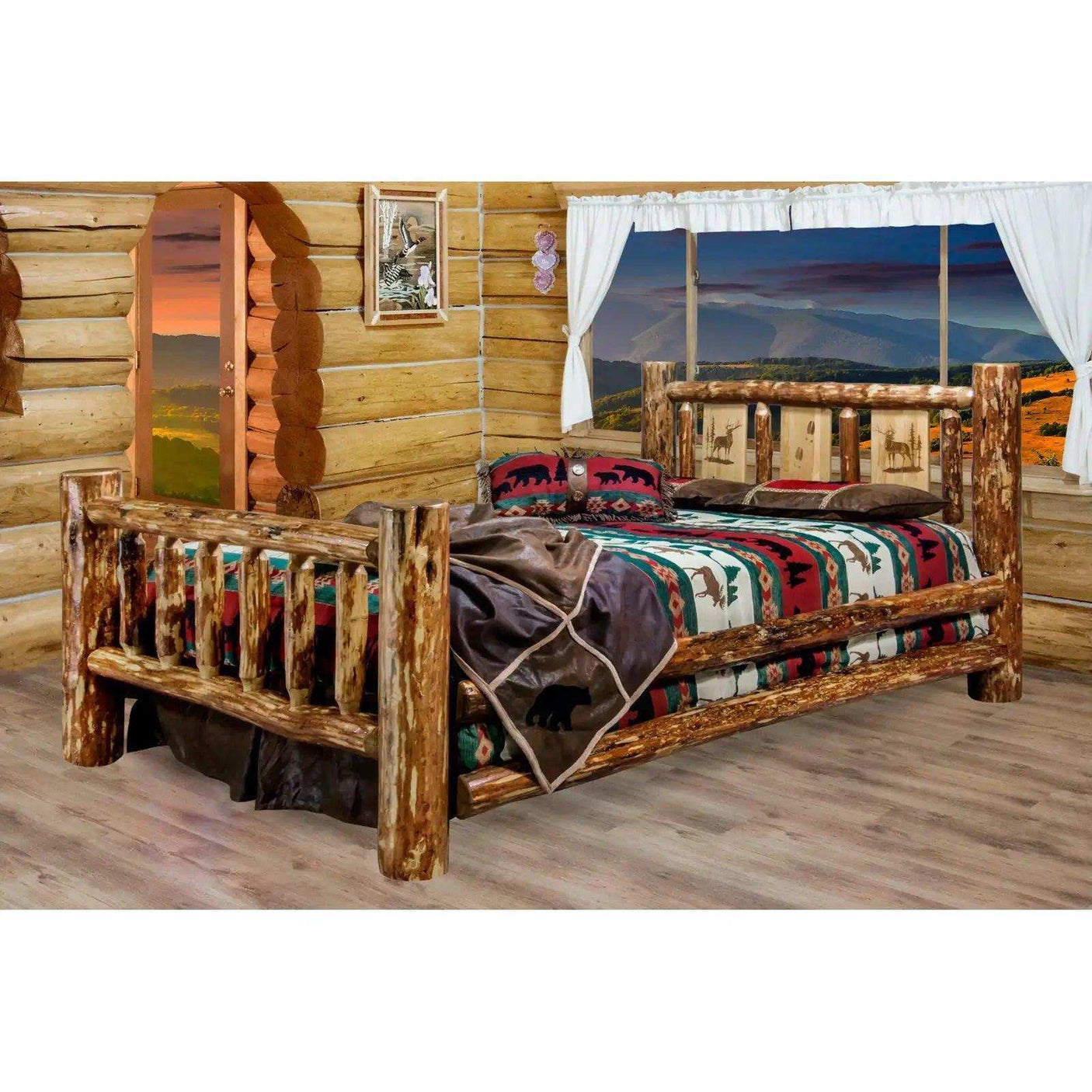 Queen log bed with laser-engraved headboard in rustic log cabin bedroom, mountain view window