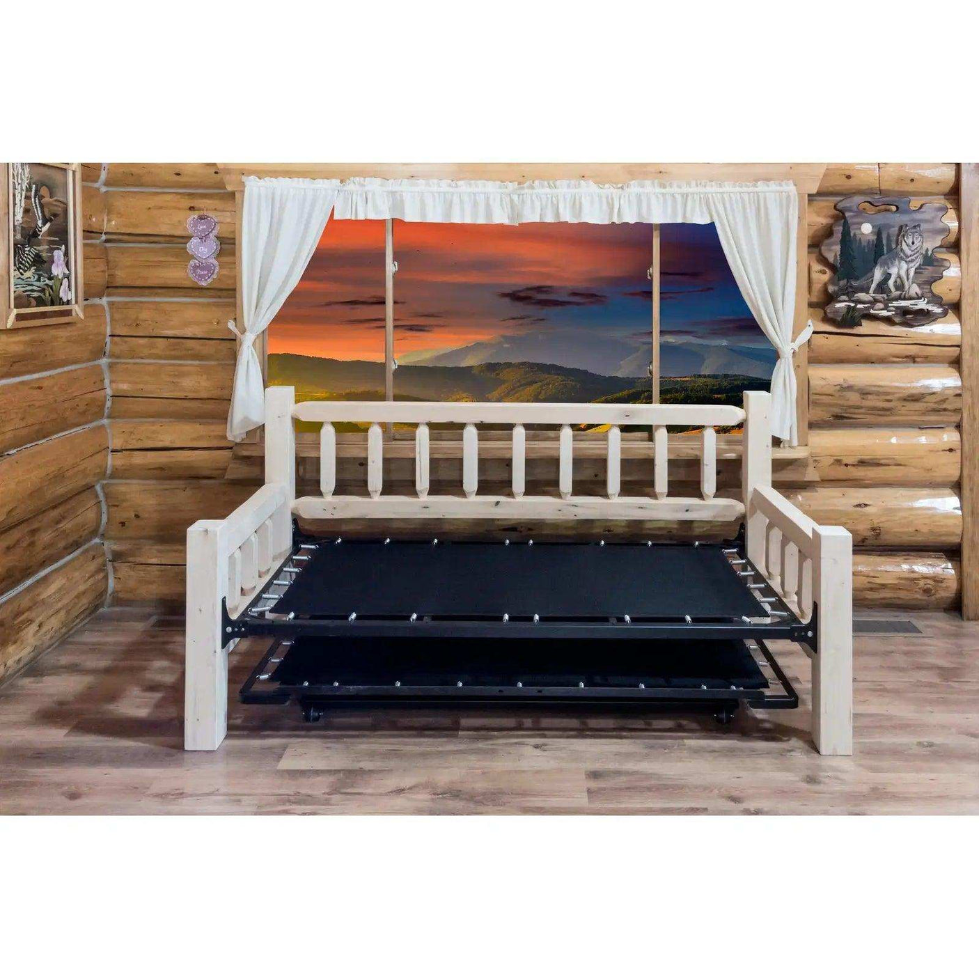 Homestead collection daybed with pop-up trundle bed in clear lacquer finish in log cabin room