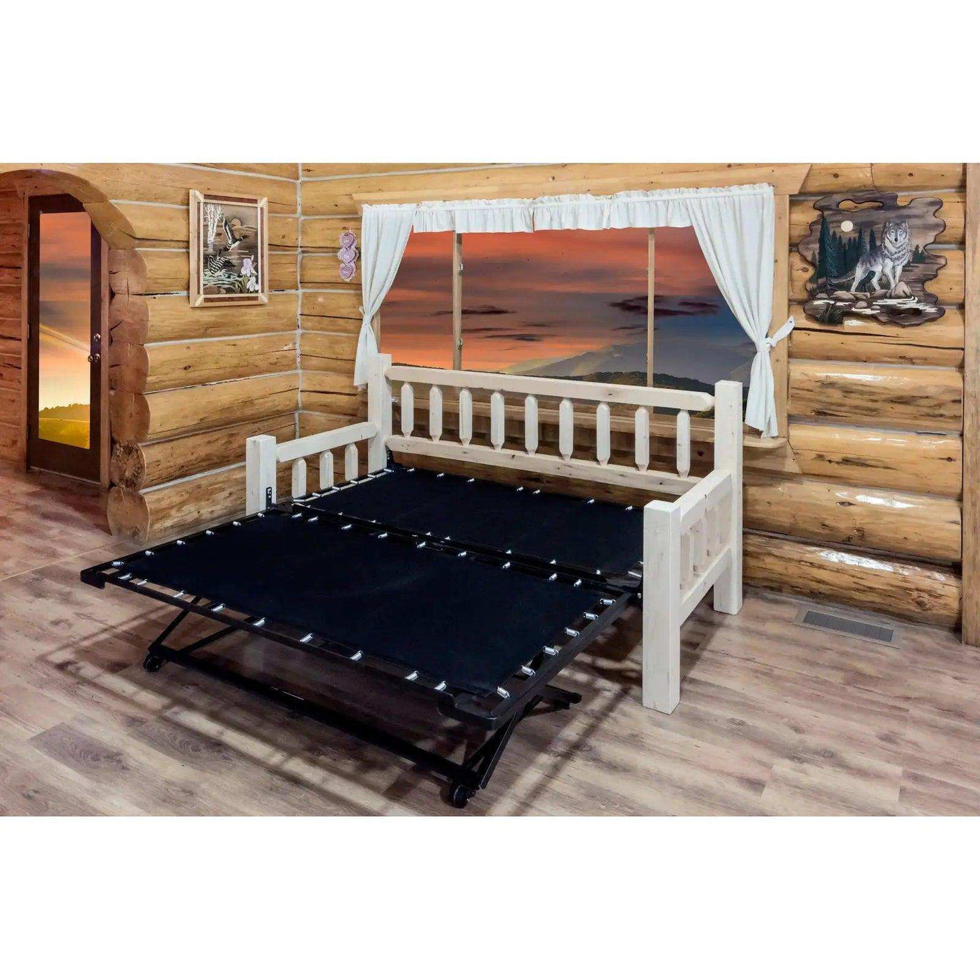 Homestead daybed with pop-up trundle in rustic log cabin room, sunset outside window