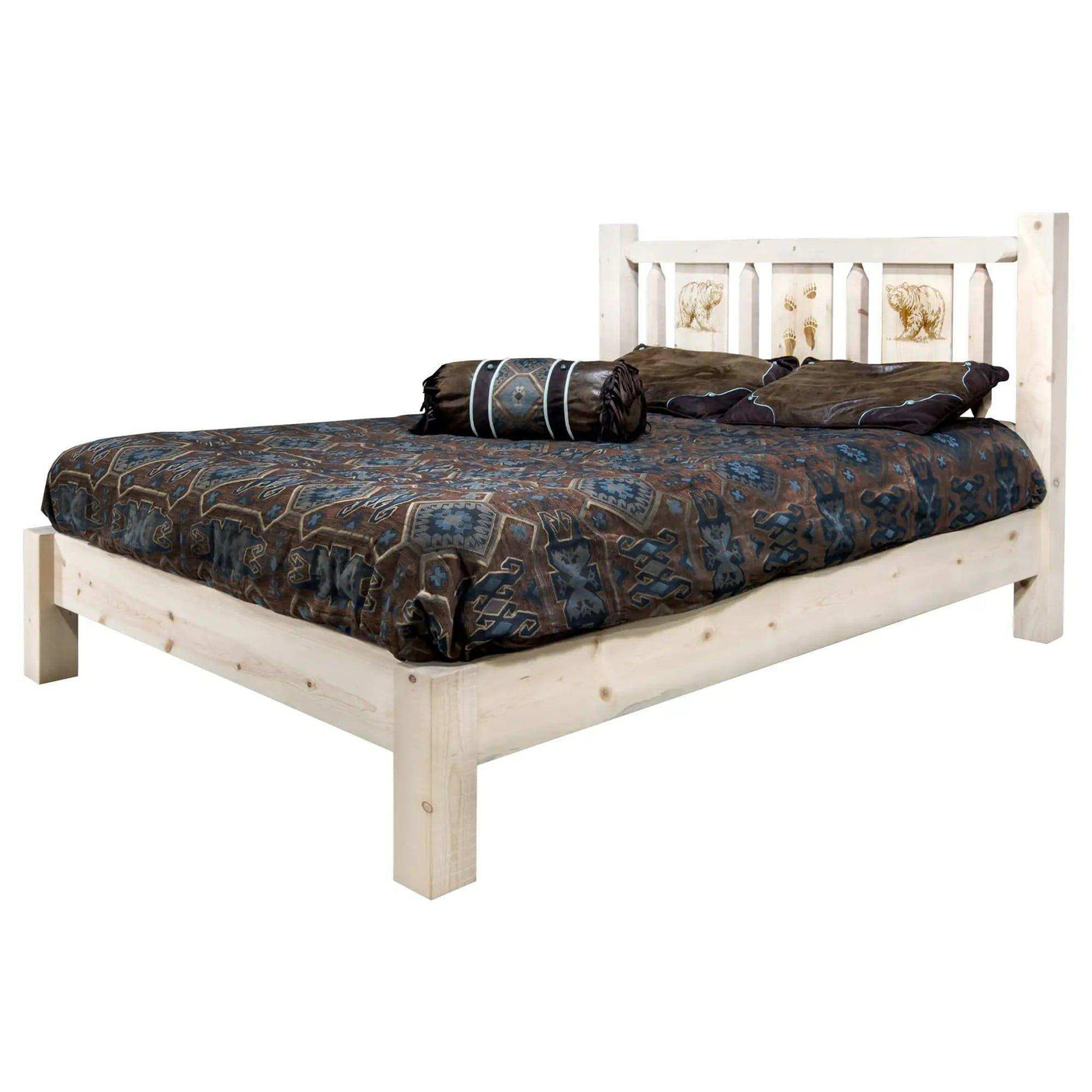 Rustic king platform bed with laser-engraved headboard and patterned bedding