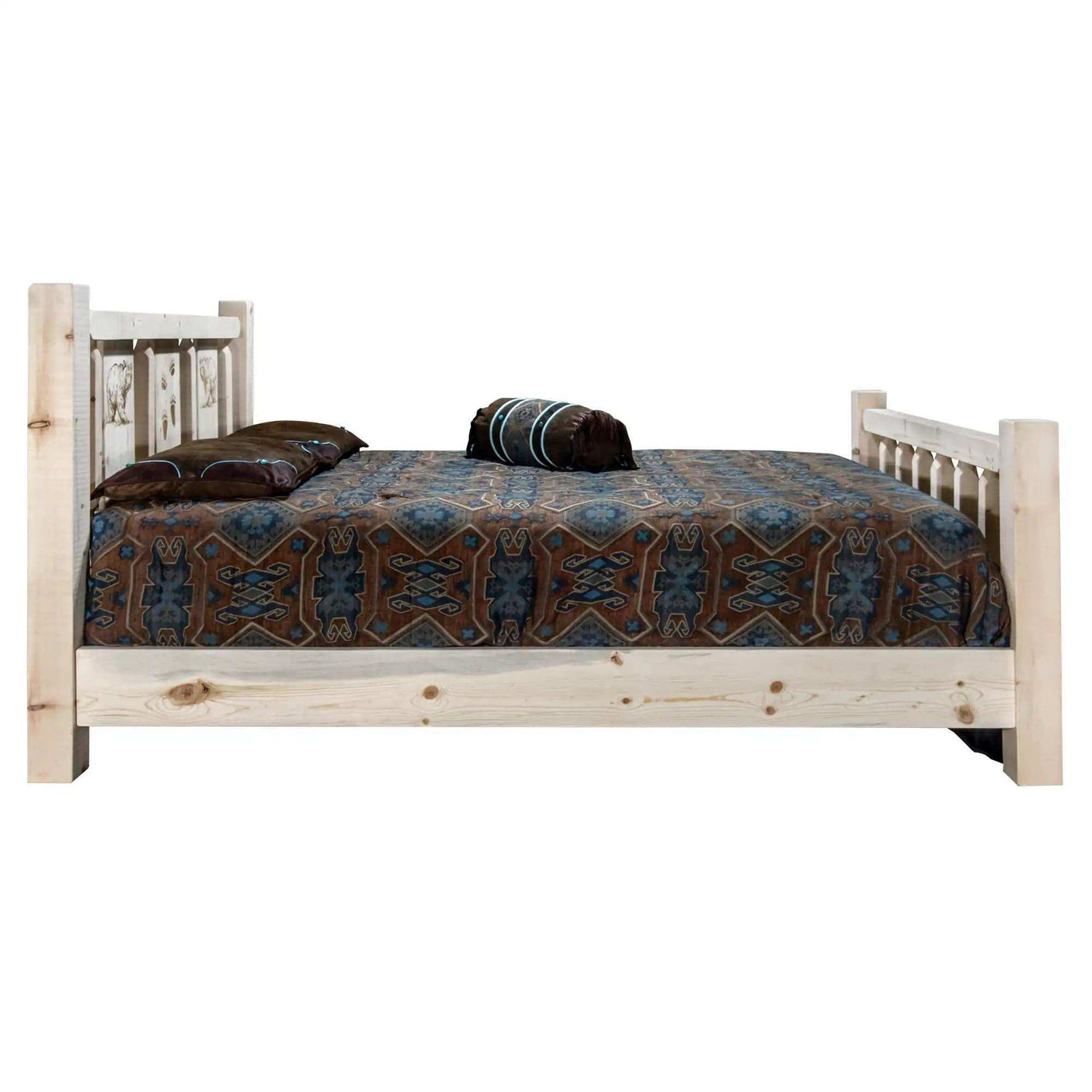 Queen bed with natural wood frame, laser-engraved headboard, and patterned bedding