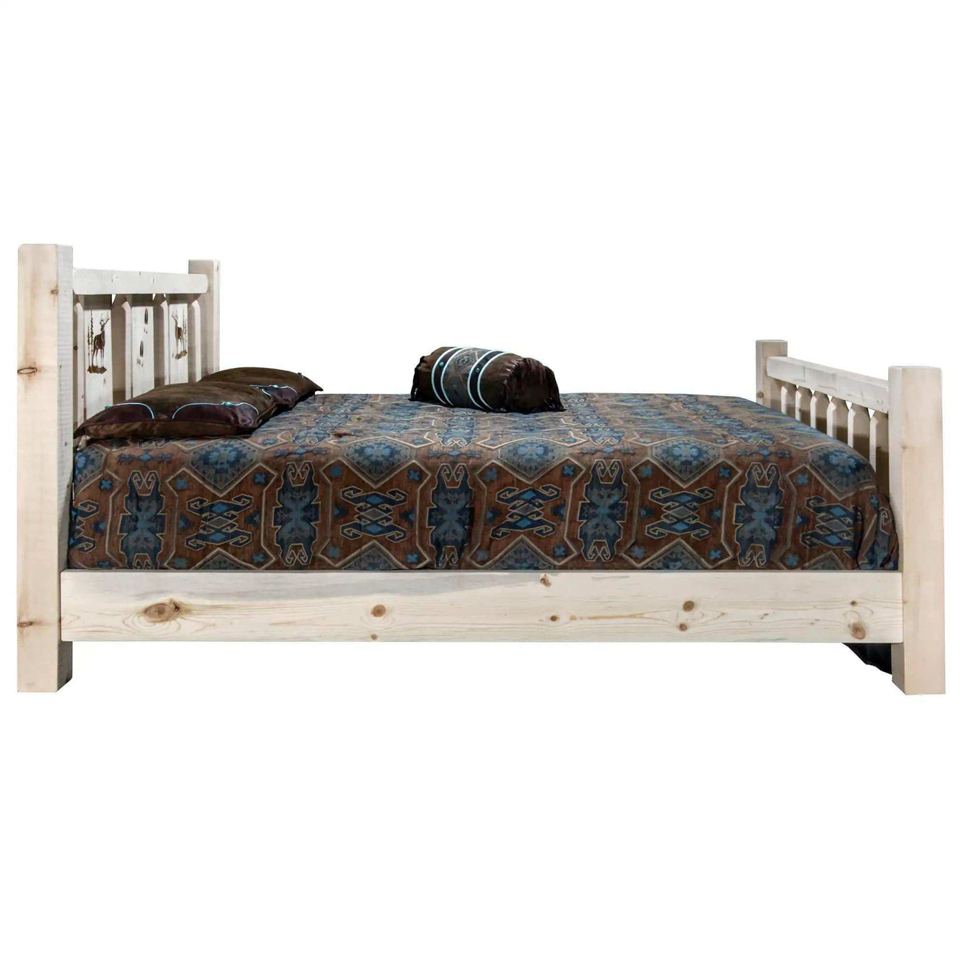 Homestead Collection queen bed with laser engraved natural wood frame and patterned bedding
