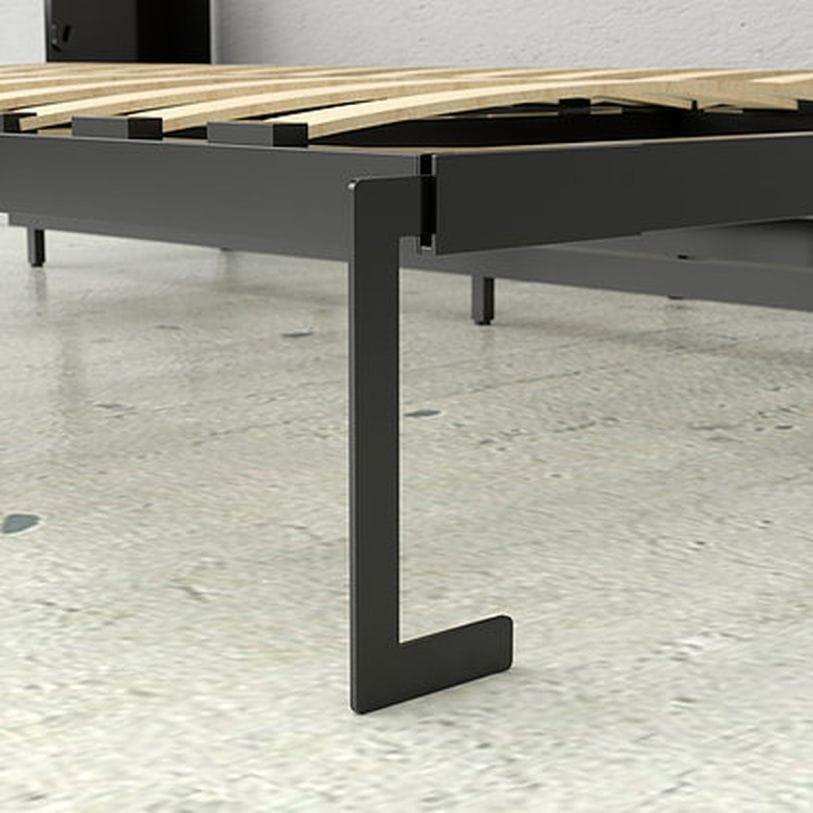 Close-up of metal Murphy bed frame leg in a modern room with light speckled flooring