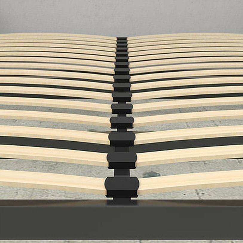 Close-up of slatted wooden queen Murphy bed frame in walnut finish on gray floor