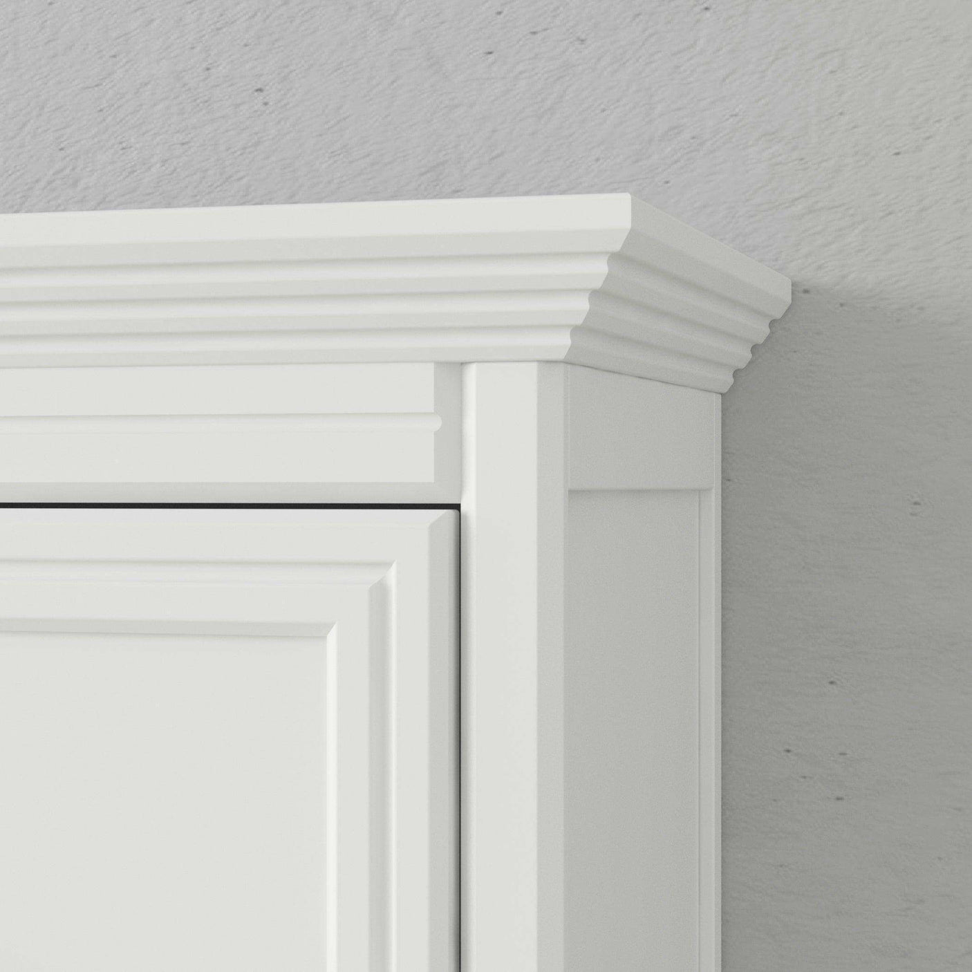 Close-up of white Murphy bed cabinet with elegant crown molding and panel detail