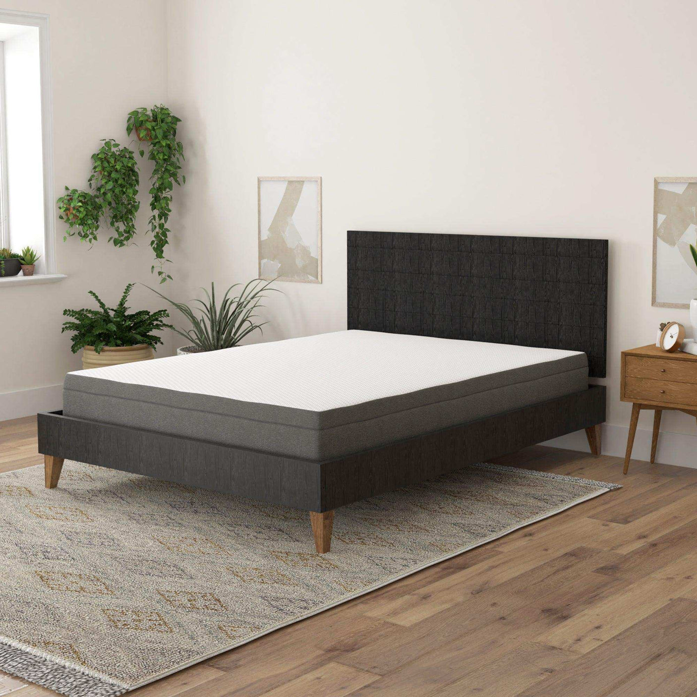 Twin memory foam mattress with edge support on dark bed frame in modern bedroom