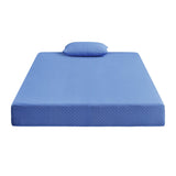 Blue memory foam mattress with matching pillow on white background