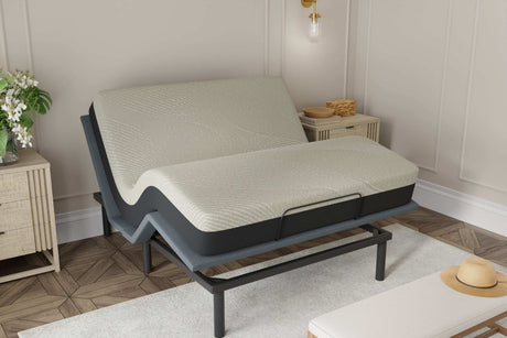 Adjustable bed with memory foam mattress in modern bedroom with nightstands and decor