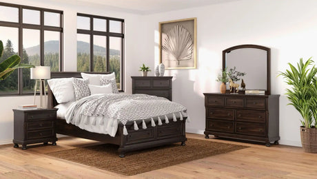 Spacious bedroom with dark wood furniture, large windows, and modern decor accents.