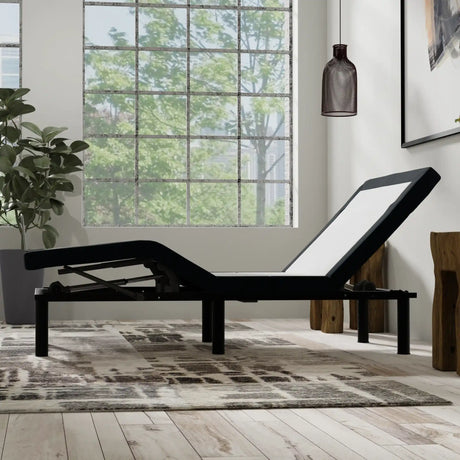 Adjustable bed frame in modern bedroom with large window and indoor plant