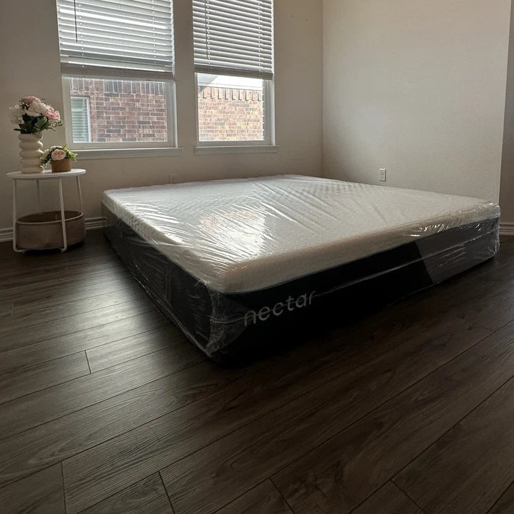 Nectar mattress on a wooden floor with large windows in the background
