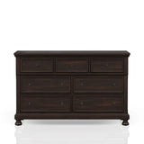 Dark wood dresser with seven drawers and vintage-style handles on white background