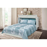 White queen cabinet bed with blue floral bedding in a modern bedroom