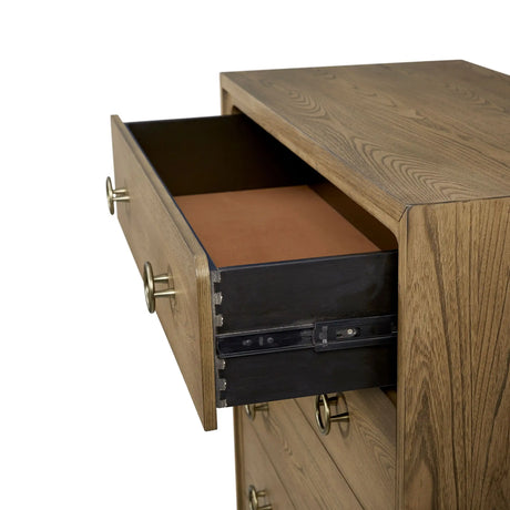 Open wood dresser drawer with brass handles and dovetail joints on white background