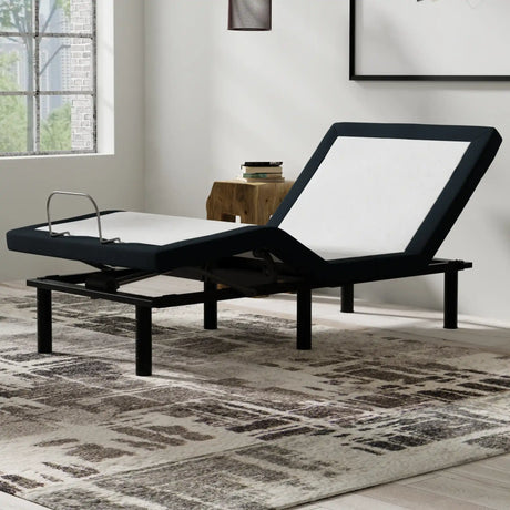 Adjustable bed frame in modern bedroom with geometric rug and wooden nightstand