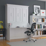 White Murphy bed with built-in desk in modern home office, ergonomic chair, bookshelf