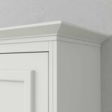 White vertical Murphy bed cabinet with crown molding detail