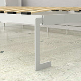 Close-up of a white queen Murphy bed frame with metal leg on a glossy floor