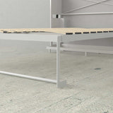 White queen Murphy bed metal frame with wood slats in a modern minimalist room