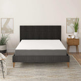 Twin memory foam mattress with edge support on modern dark bed frame in stylish bedroom