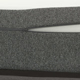 Close-up of twin memory foam mattress with grey fabric cover and visible zipper opening